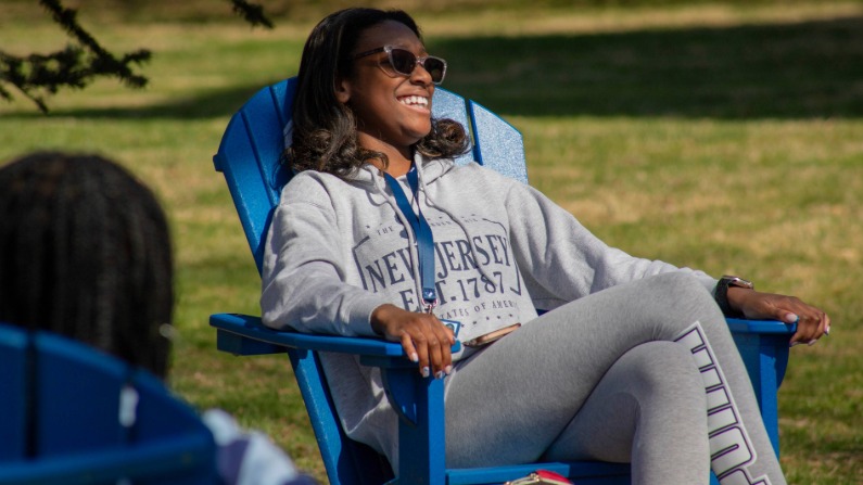 Student in adirondak chair