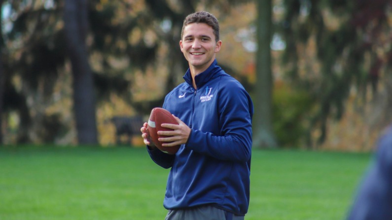 Student holding football
